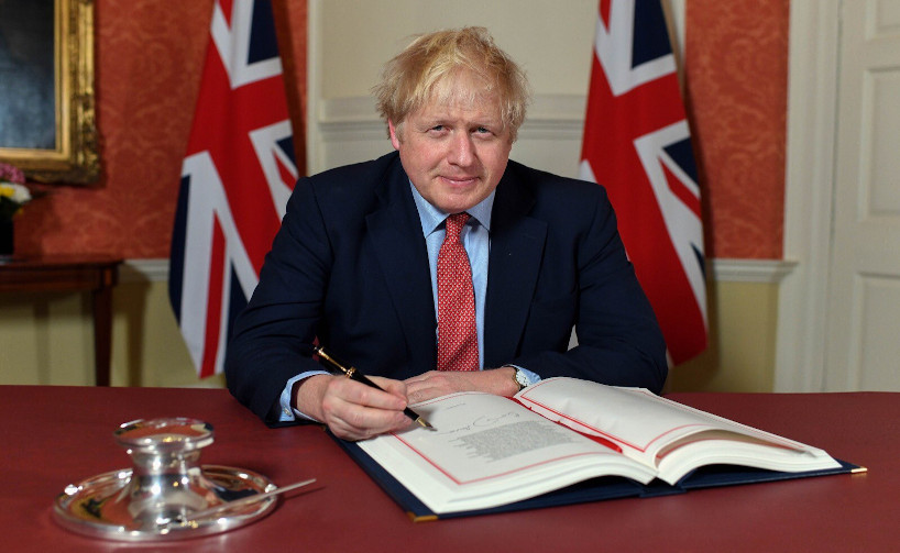 britain's prime minister boris johnson signs brexit agreement