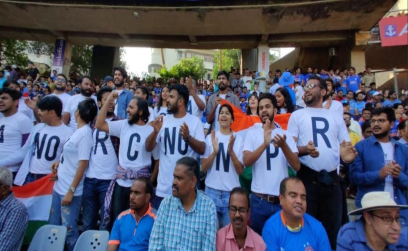 group of students showing opposition to caa at wankhede ground